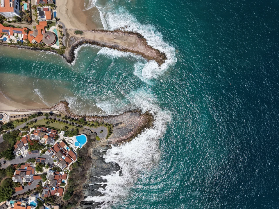 Waves around coastal breakwaters